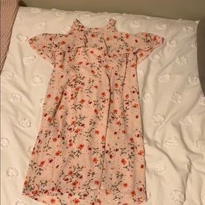 Floral dress that shows shoulders.